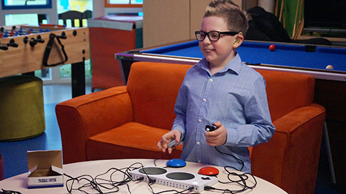 Shay playing games with the Interactive Entertainment Hub